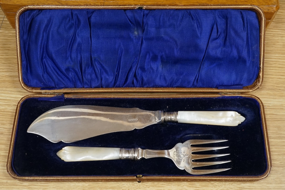 Four cased sets of silver plated flatware, including a carving set with antler handles, silver mounted.
